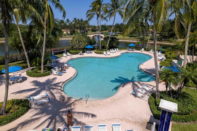7720 Pine Island Way, West Palm Beach, FL 33411 - community pool featuring a water view and a patio