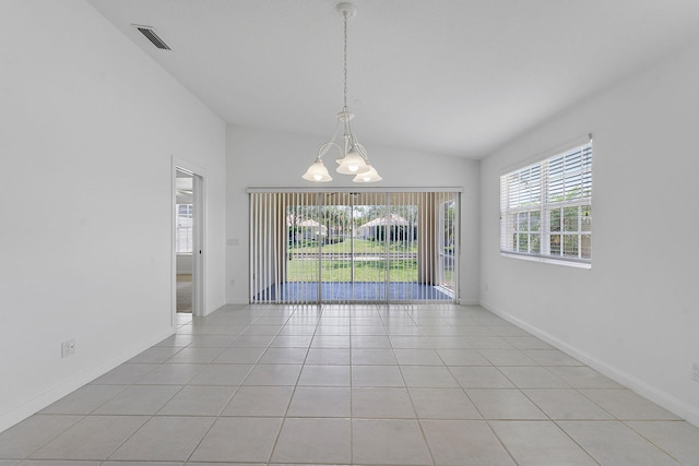 unfurnished dining area with a chandelier, light tile patterned flooring, vaulted ceiling, and baseboards