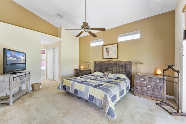 4911 Tropical Garden Dr, Boynton Beach, FL 33436 - carpeted bedroom featuring high vaulted ceiling, a closet, connected bathroom, and ceiling fan