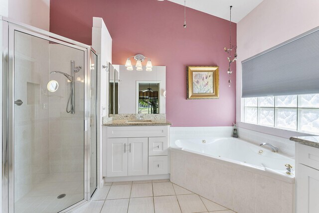 4911 Tropical Garden Dr, Boynton Beach, FL 33436 - bathroom with a shower stall, a jetted tub, vanity, and tile patterned floors