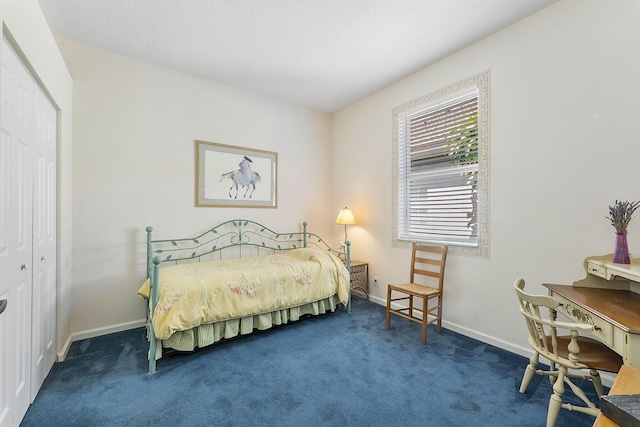 4911 Tropical Garden Dr, Boynton Beach, FL 33436 - carpeted bedroom featuring a closet and baseboards