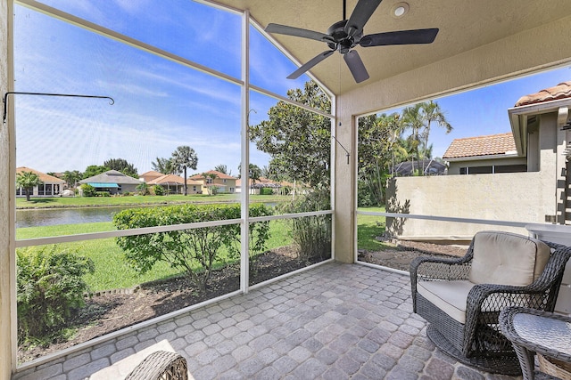 4911 Tropical Garden Dr, Boynton Beach, FL 33436 - sunroom with ceiling fan, a water view, and a residential view