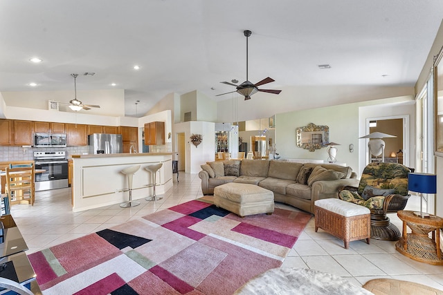4911 Tropical Garden Dr, Boynton Beach, FL 33436 - living area with ceiling fan, vaulted ceiling, light tile patterned floors, and recessed lighting