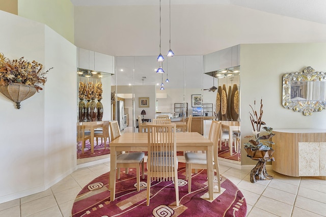 4911 Tropical Garden Dr, Boynton Beach, FL 33436 - dining area featuring light tile patterned floors and high vaulted ceiling