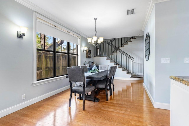 507 SW 17th St, Fort Lauderdale, FL 33315 - dining space featuring a chandelier, stairs, crown molding, and baseboards