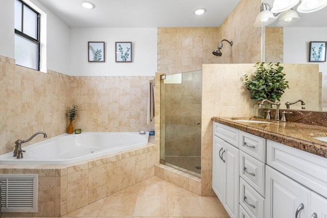 507 SW 17th St, Fort Lauderdale, FL 33315 - bathroom featuring tile walls, tiled shower, a garden tub, double vanity, and tile patterned floors