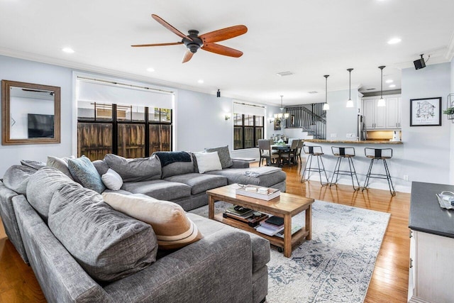 507 SW 17th St, Fort Lauderdale, FL 33315 - living area with crown molding, a ceiling fan, recessed lighting, light wood-type flooring, and a chandelier