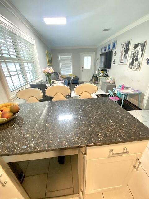 1119 S Ridge St, Lake Worth, FL 33460 - kitchen with crown molding and dark stone countertops