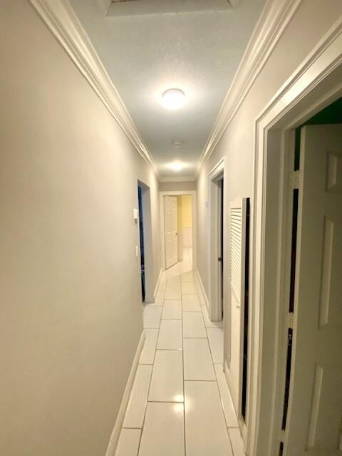 1119 S Ridge St, Lake Worth, FL 33460 - corridor featuring light tile patterned flooring, ornamental molding, and baseboards