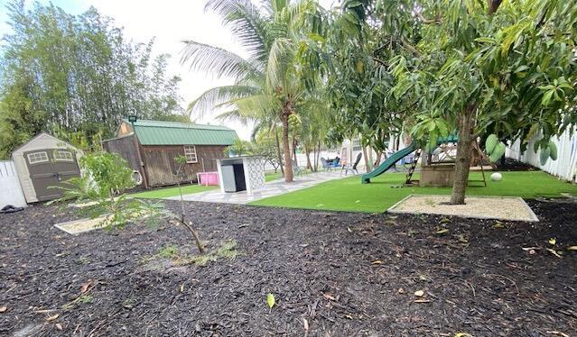 1119 S Ridge St, Lake Worth, FL 33460 - view of yard with a playground