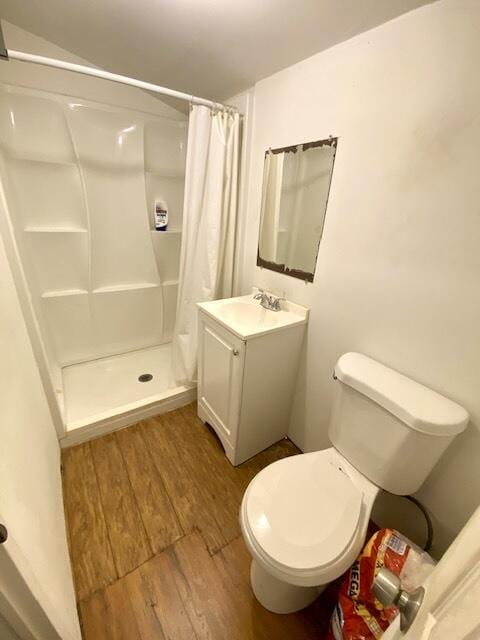 1119 S Ridge St, Lake Worth, FL 33460 - full bath featuring wood finished floors, vanity, a shower stall, and toilet