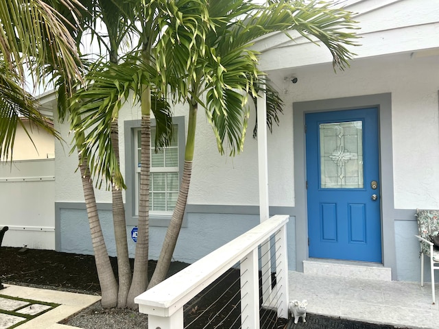 1119 S Ridge St, Lake Worth, FL 33460 - doorway to property featuring stucco siding
