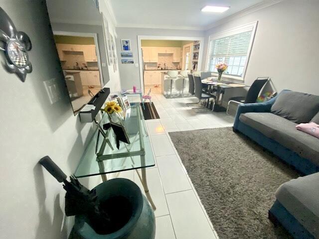 1119 S Ridge St, Lake Worth, FL 33460 - living room featuring ornamental molding and tile patterned flooring