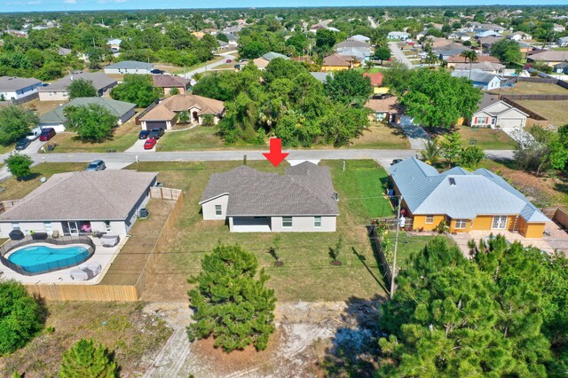 aerial perspective of suburban area with a pool area