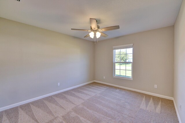 5800 NW Whitecap Rd, Port Saint Lucie, FL 34986 - carpeted spare room featuring a ceiling fan and baseboards