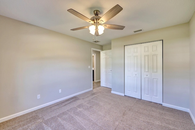 5800 NW Whitecap Rd, Port Saint Lucie, FL 34986 - unfurnished bedroom featuring carpet, baseboards, a closet, and ceiling fan