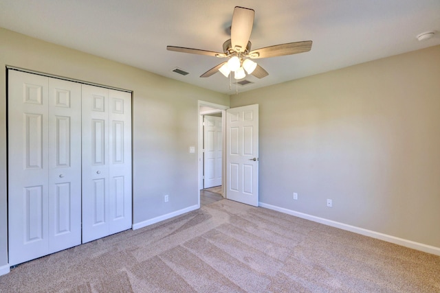 5800 NW Whitecap Rd, Port Saint Lucie, FL 34986 - unfurnished bedroom with carpet flooring, baseboards, a closet, and ceiling fan