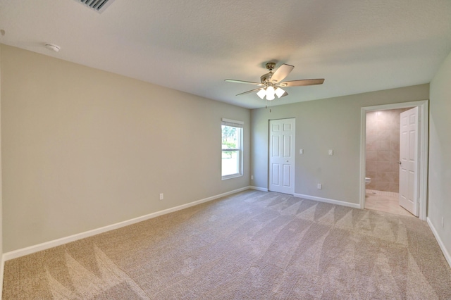 5800 NW Whitecap Rd, Port Saint Lucie, FL 34986 - unfurnished bedroom with light carpet, baseboards, a closet, and a ceiling fan