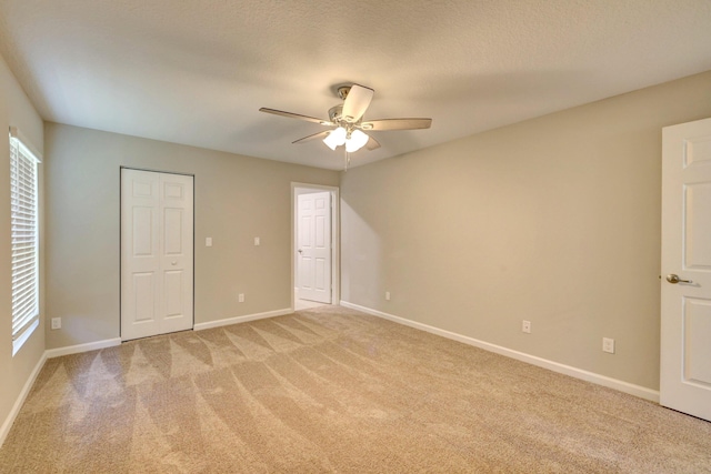 5800 NW Whitecap Rd, Port Saint Lucie, FL 34986 - unfurnished bedroom with light colored carpet, baseboards, and ceiling fan