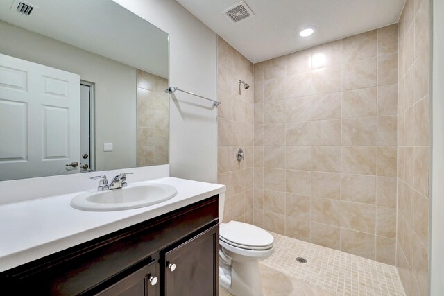 5800 NW Whitecap Rd, Port Saint Lucie, FL 34986 - full bath featuring a tile shower, vanity, toilet, recessed lighting, and tile patterned floors