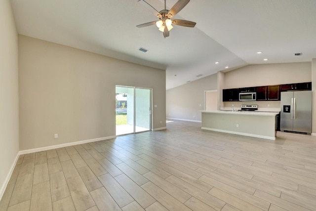 5800 NW Whitecap Rd, Port Saint Lucie, FL 34986 - unfurnished living room with vaulted ceiling, a ceiling fan, recessed lighting, light wood-type flooring, and baseboards