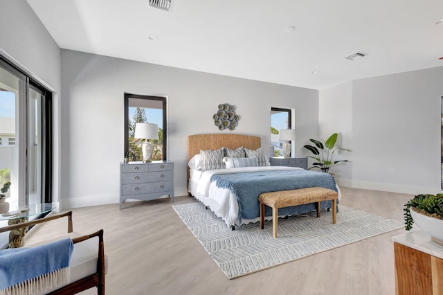 bedroom featuring light wood-type flooring and baseboards