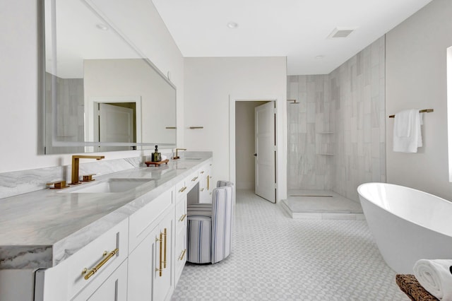 full bath with walk in shower, double vanity, and a freestanding bath