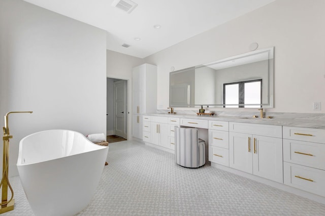 full bath with double vanity and a soaking tub