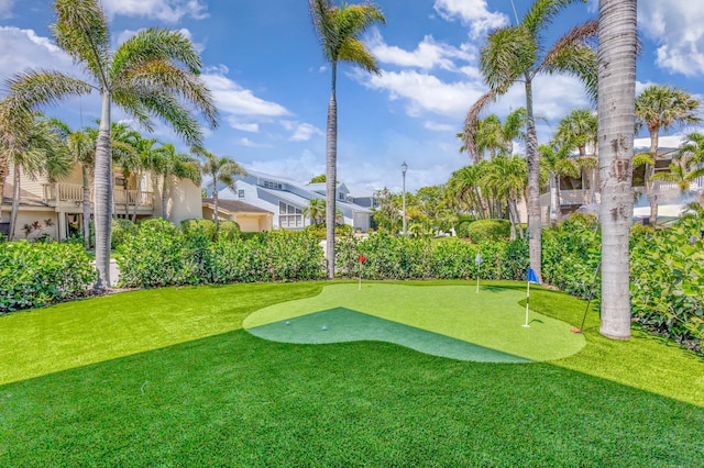 surrounding community with a putting area