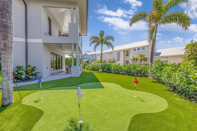 surrounding community with a putting area
