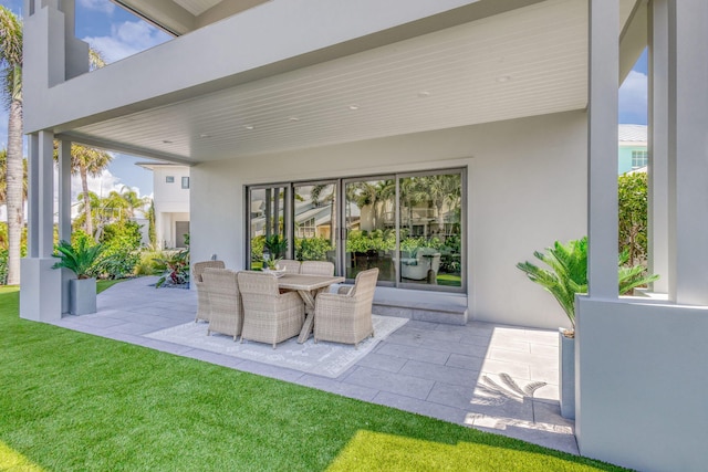 view of patio featuring outdoor dining area