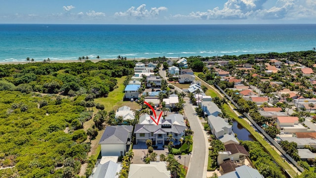 aerial view of residential area with a nearby body of water