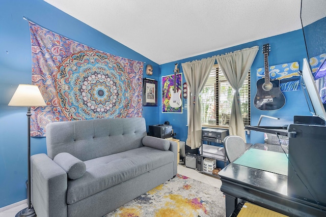 office space featuring vaulted ceiling and tile patterned floors