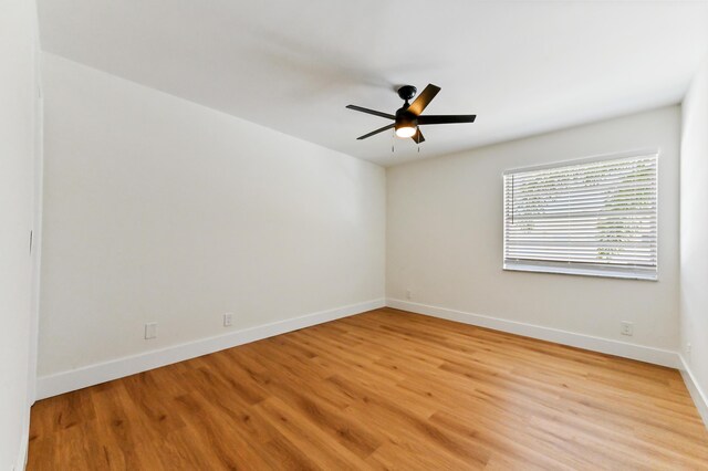 278 Normandy F, Delray Beach, FL 33484 - empty room with light wood-style flooring, ceiling fan, and baseboards