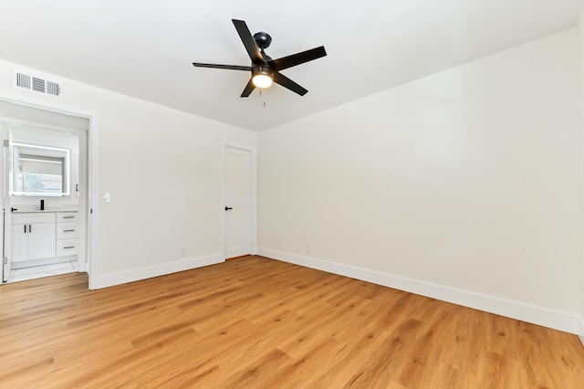 278 Normandy F, Delray Beach, FL 33484 - unfurnished bedroom with baseboards, light wood-style flooring, and ceiling fan