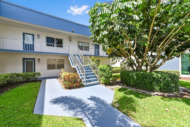 278 Normandy F, Delray Beach, FL 33484 - view of property with stairs