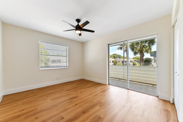 278 Normandy F, Delray Beach, FL 33484 - empty room featuring healthy amount of natural light, light wood finished floors, a ceiling fan, and baseboards