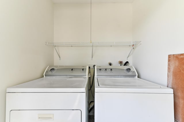 278 Normandy F, Delray Beach, FL 33484 - clothes washing area with washing machine and clothes dryer