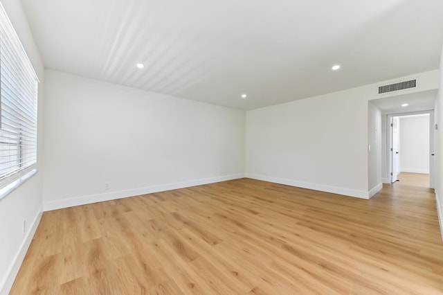 278 Normandy F, Delray Beach, FL 33484 - unfurnished room featuring light wood-style floors, recessed lighting, and baseboards