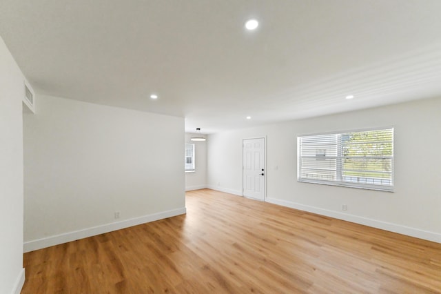 278 Normandy F, Delray Beach, FL 33484 - spare room featuring light wood-style floors, plenty of natural light, recessed lighting, and baseboards