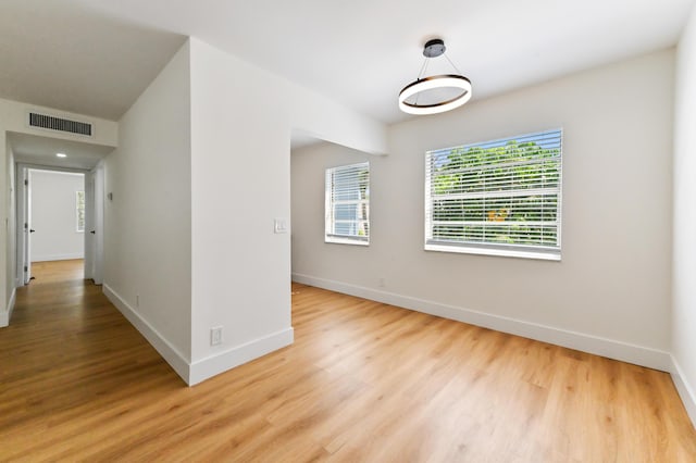 278 Normandy F, Delray Beach, FL 33484 - spare room with light wood-style floors and baseboards