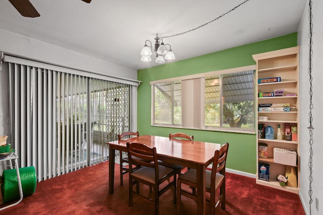 1402 SE Buckingham Ter, Port Saint Lucie, FL 34952 - carpeted dining space with a chandelier and a ceiling fan