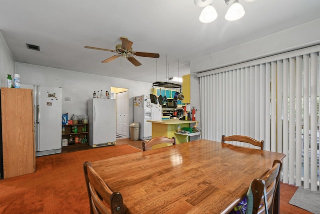 1402 SE Buckingham Ter, Port Saint Lucie, FL 34952 - carpeted dining area featuring a ceiling fan