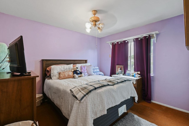 1402 SE Buckingham Ter, Port Saint Lucie, FL 34952 - bedroom featuring baseboards, ceiling fan, and carpet floors