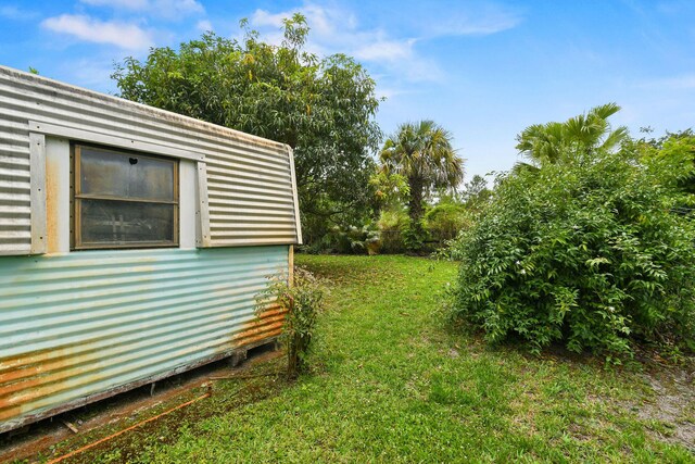 1402 SE Buckingham Ter, Port Saint Lucie, FL 34952 - view of green lawn