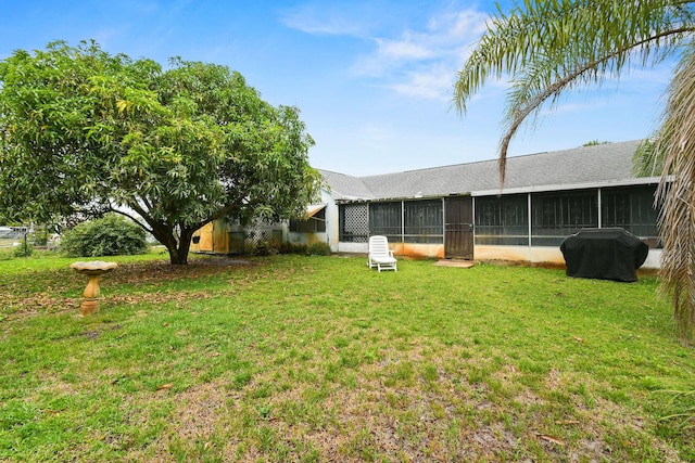 1402 SE Buckingham Ter, Port Saint Lucie, FL 34952 - rear view of property with a sunroom, a yard, and roof with shingles