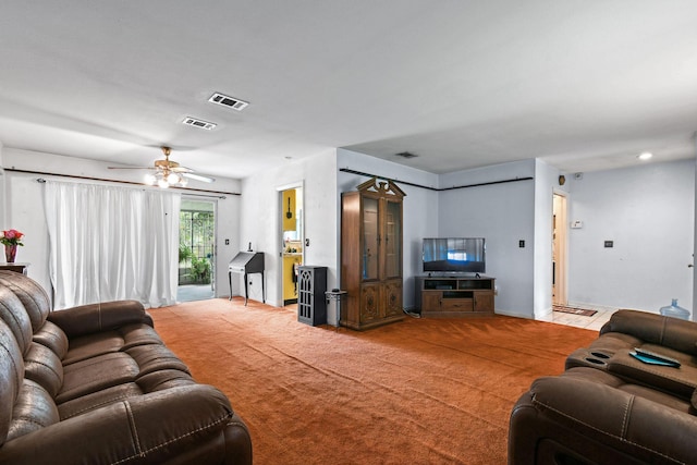 1402 SE Buckingham Ter, Port Saint Lucie, FL 34952 - living room featuring carpet floors, ceiling fan, and baseboards