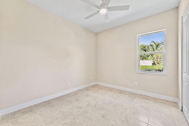 unfurnished room with baseboards and ceiling fan
