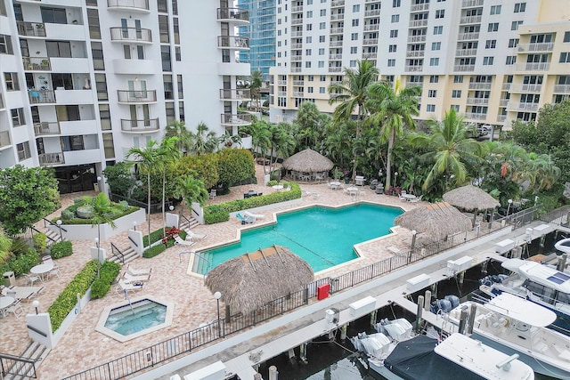 community pool with a gazebo and a patio area
