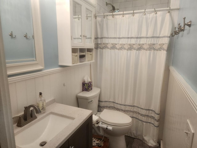 832 N D St, Lake Worth Beach, FL 33460 - full bath featuring a wainscoted wall, toilet, curtained shower, a decorative wall, and vanity
